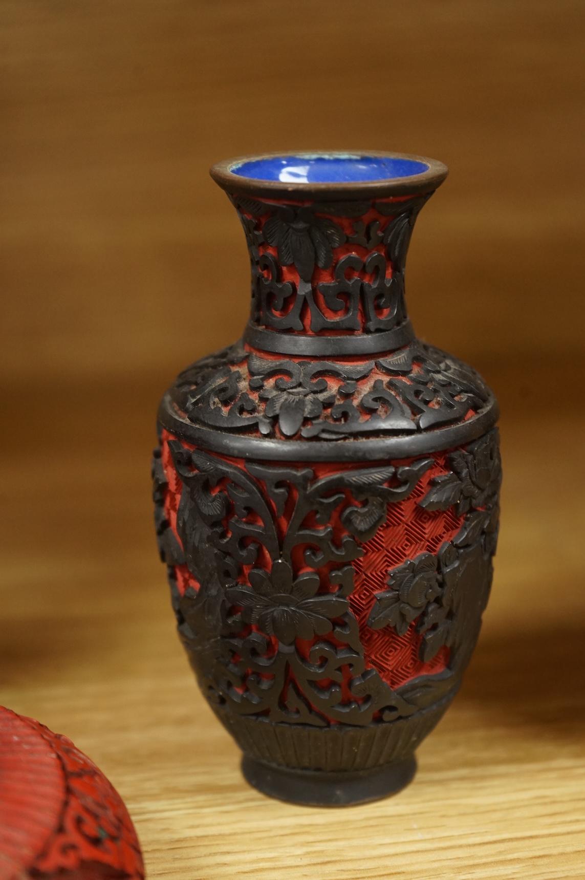 Two Chinese cinnabar lacquer vases and an ashtray, largest 20cm high